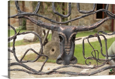 Georgia, Mtskheta, Decorative bull head on a metal fence