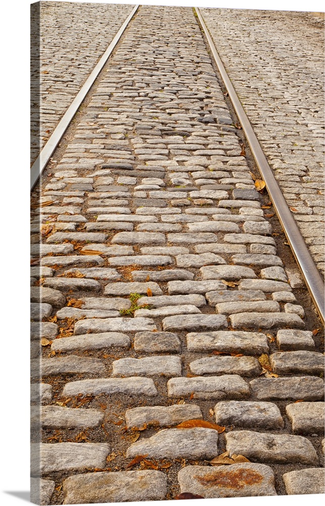 USA, Georgia, Savannah, Old railroad tracks and cobble stones along River Street.