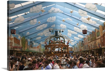 Germany, Munich, Revelers inside one of the many beer halls at Oktoberfest