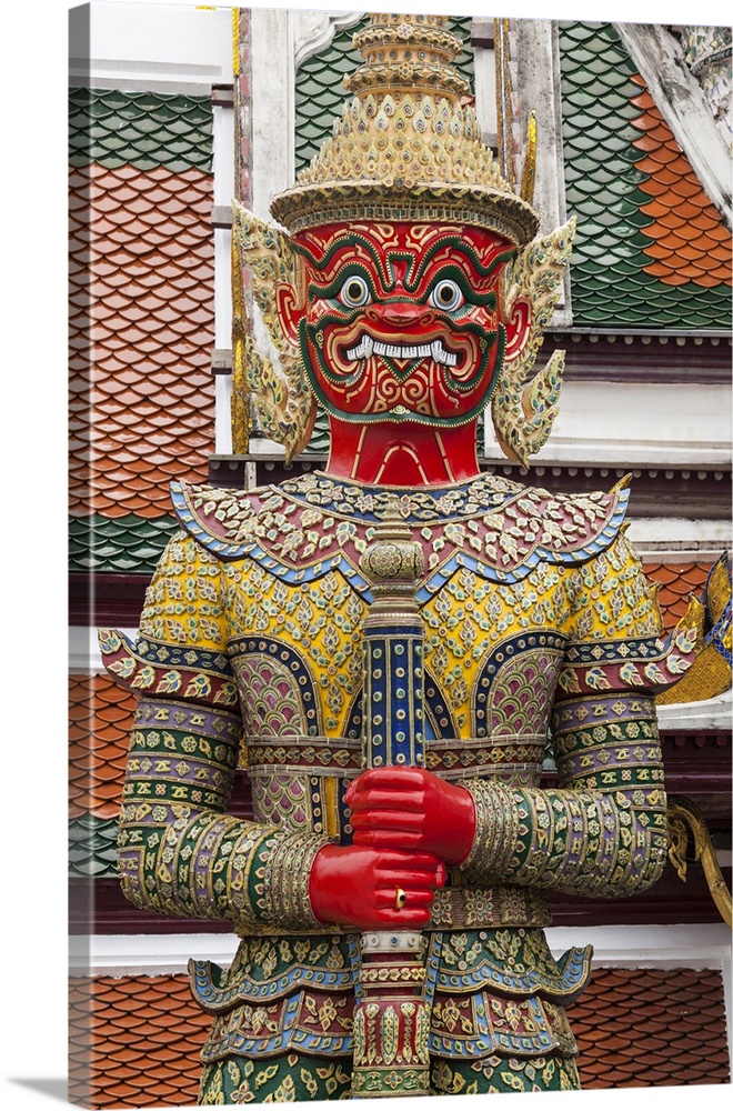 Thailand, Bangkok,.giant demon Suryapop guards the eastern entrance of Emerald Buddha Temple in the Royal Palace complex.