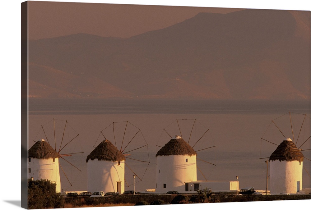 Europe, Greece, Cyclades Islands, Mykonos. Sunrise with Mykonos windmills