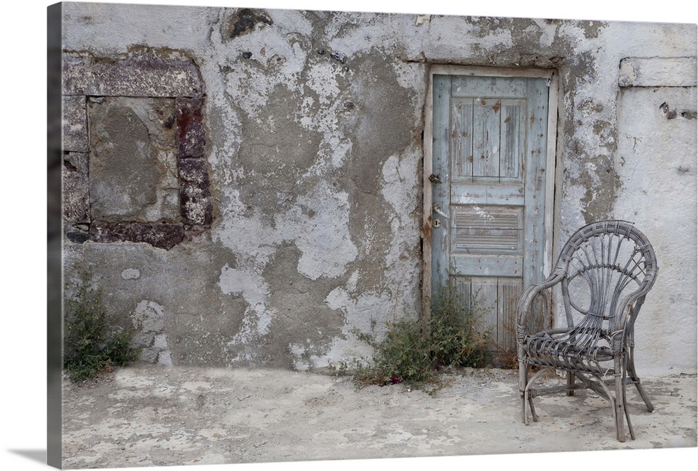 Europe, Greece, Greek Island, Santorini, Old Building chair and doorway in town of Oia
