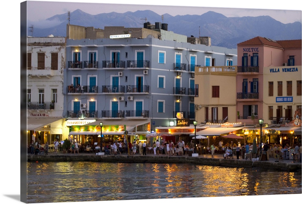 Greek Island of Crete and old town of Chania evening light along the old harbor and the colorful buildings