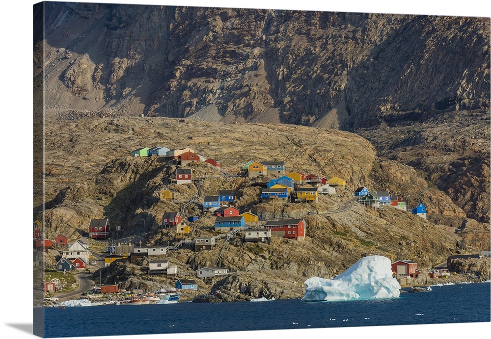 Greenland. Uummannaq. Colorful houses dot the rocky landscape.