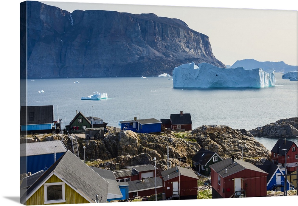 Greenland. Uummannaq. Colorful houses dot the rocky landscape.