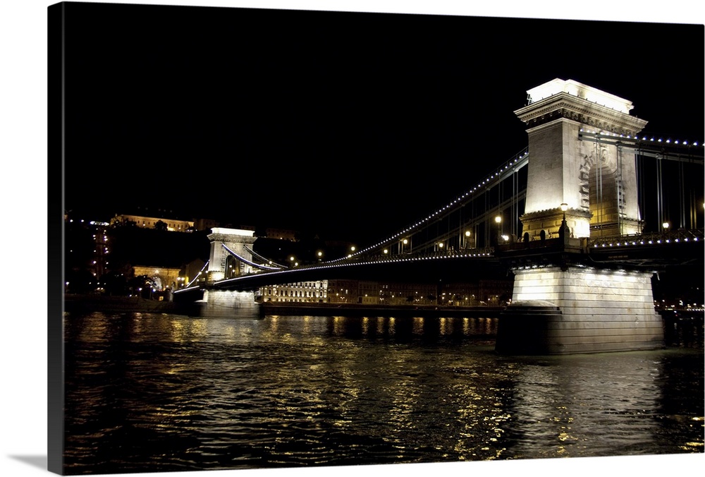 Hungary, Budapest. Night view of "Chain Bridge" from Pest across the Danube River to Castle Hill in Buda.