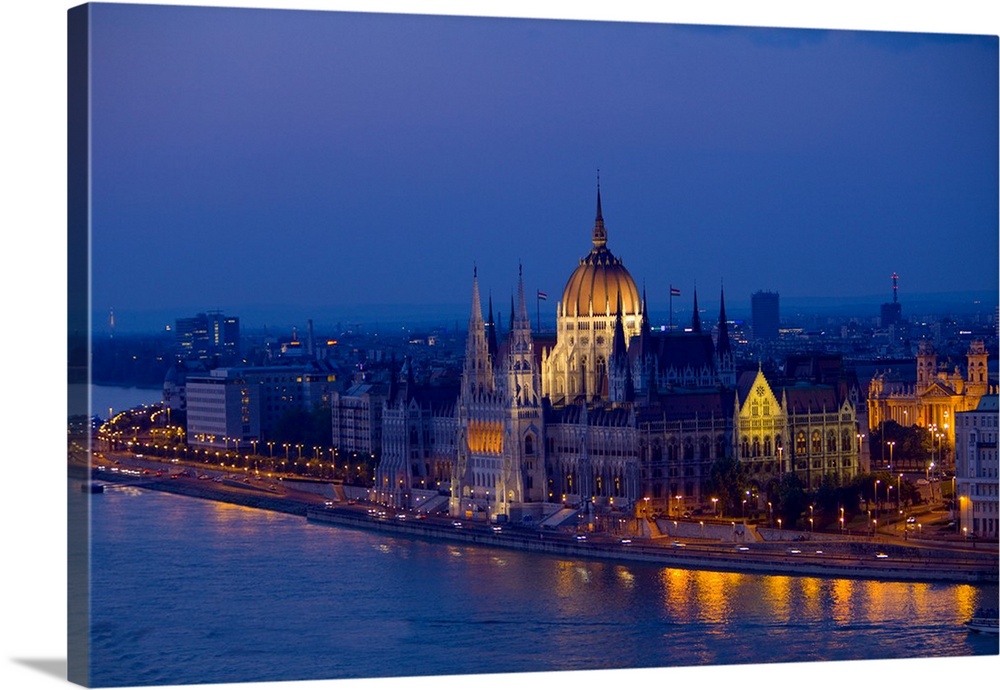 Europe, Hungary, Budapest. Nighttime overview of the Parliament Building and city next to River Danube. Credit as: Jim Zuc...