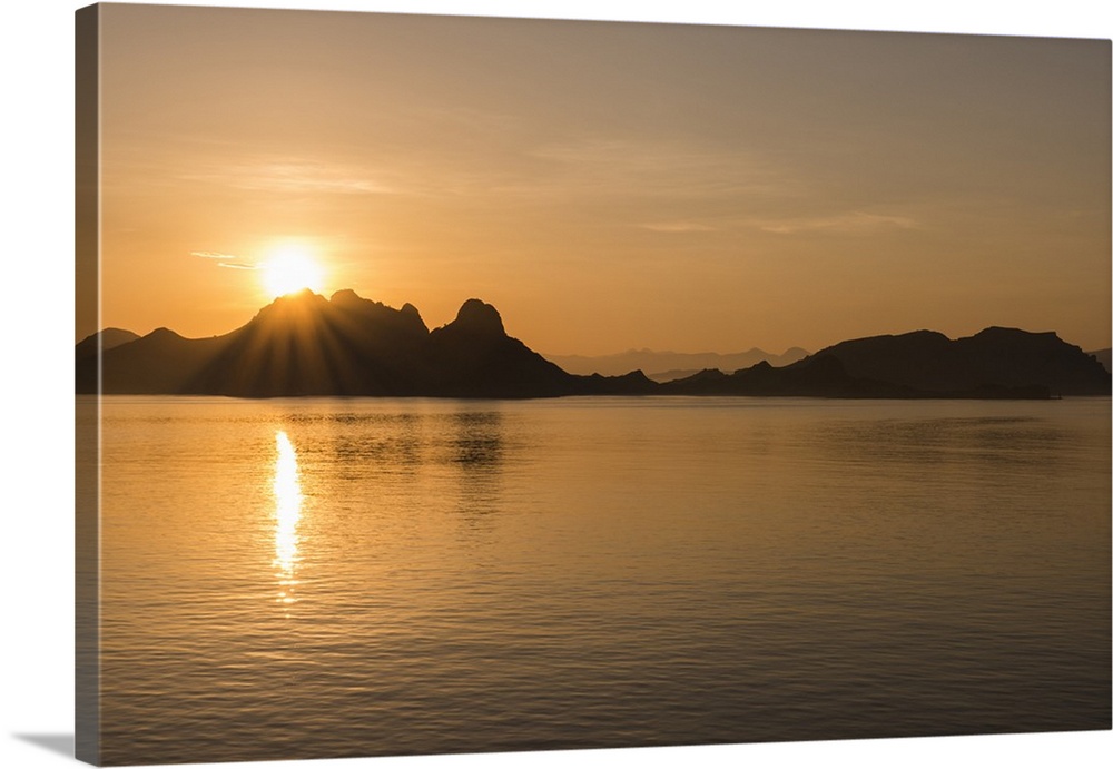 Indonesia, Komodo Island. Komodo National Park. Sunrise over the Suva Sea and Komodo Island..