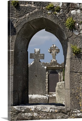 Ireland, County Mayo, Burrishoole Abbey. Tombstones with crosses framed by stone archway