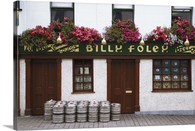 Ireland, County Tipperary. Beer barrels in front of Billy Foley pub