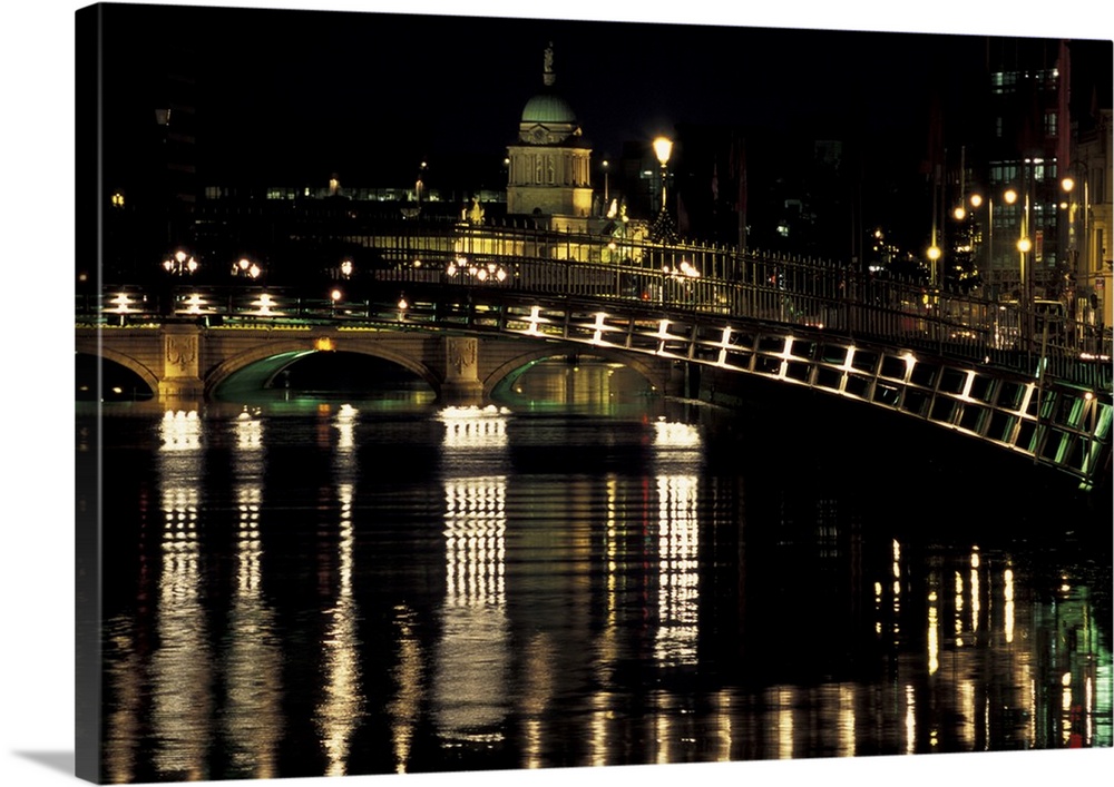 Europe, Ireland, Dublin. Ha'penny Bridge and O'Connell Bridge spanning River Liffey, Custom House dome in distance