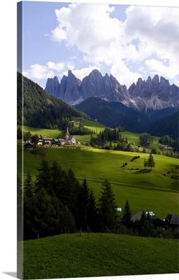 Isolated church St. Maddalena and village, Italian Dolomites village Val Di Funes, Italy