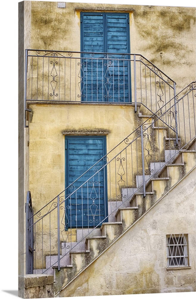 Italy, Basilicata, Matera. Stairs leading to blue doors and shutters in old town Matera.