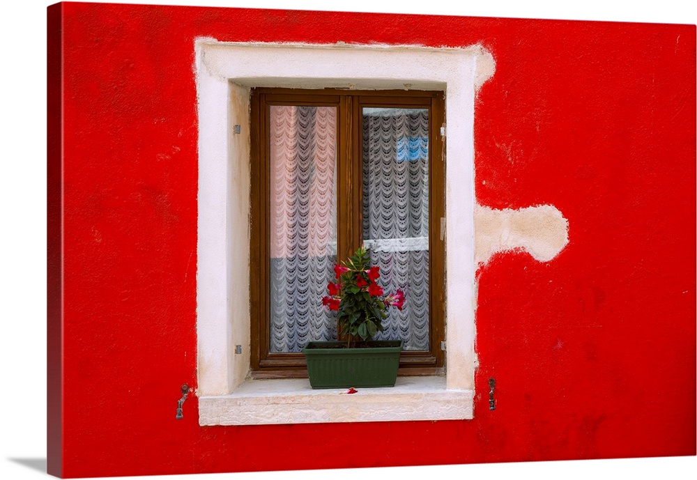 Italy, Burano. Colorful house wall and window. Credit: Jim Nilsen