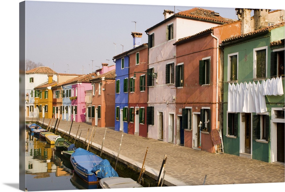 Europe, Italy, Burano. Colorful houses of line a canal.