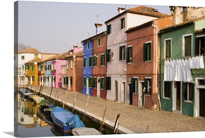 Italy, Burano, Colorful houses line canal