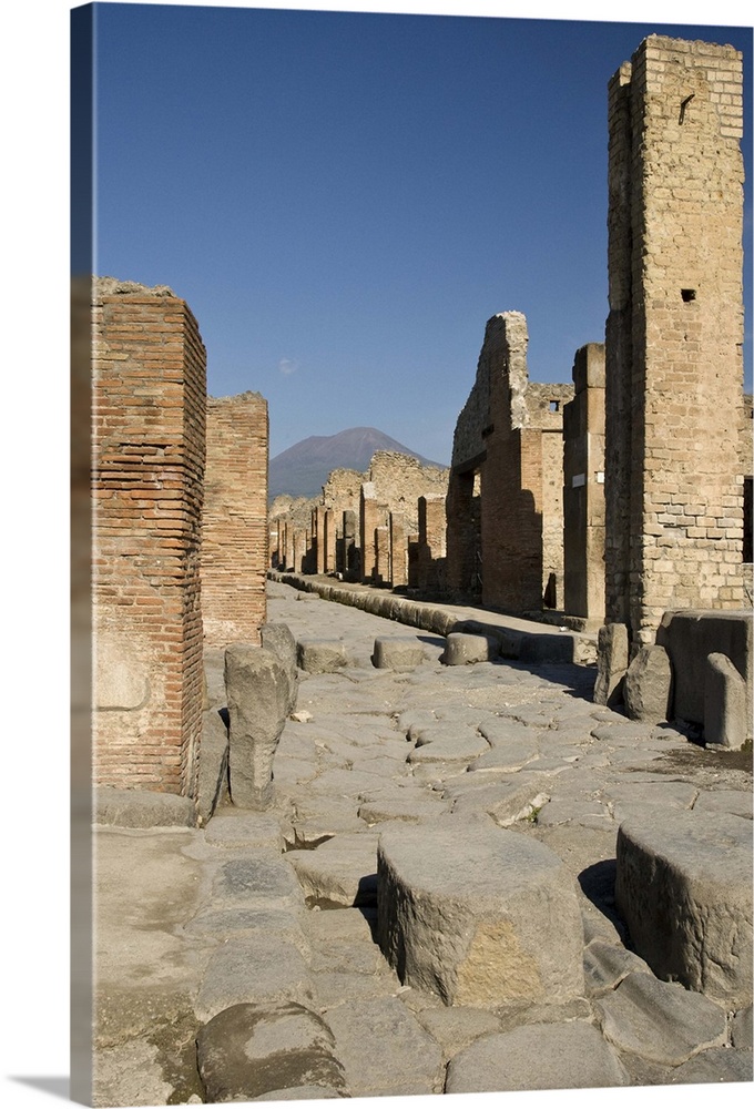 Europe, Europe,Italy, Campania, Pompeii. Uncovered streets of the ruined city with Mount Vesuvius in background.