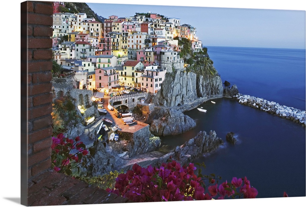 Europe, Italy, Cinque Terre, Manarola. Dusk on a scenic coastline town.