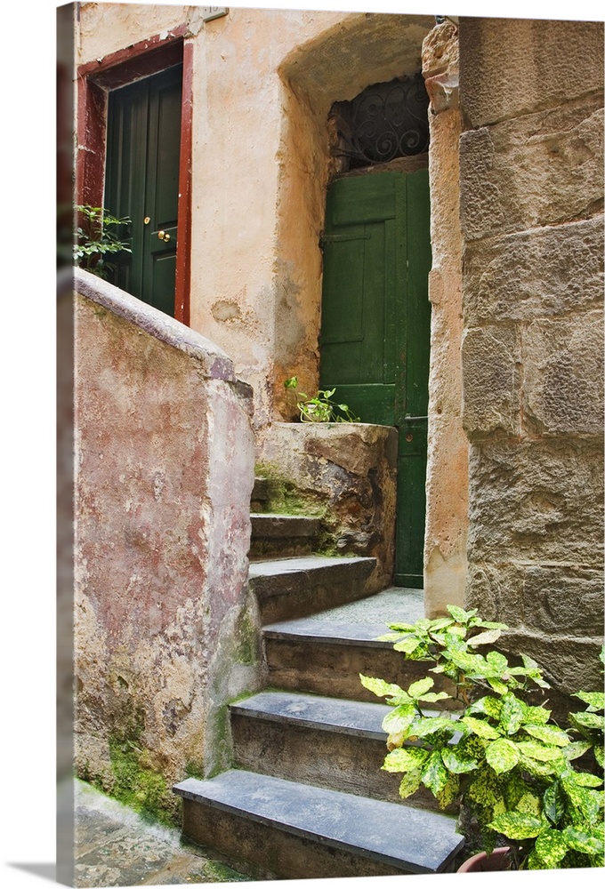 Europe, Italy, Cinque Terre, Vernazza. Front steps to steps lead to a home.