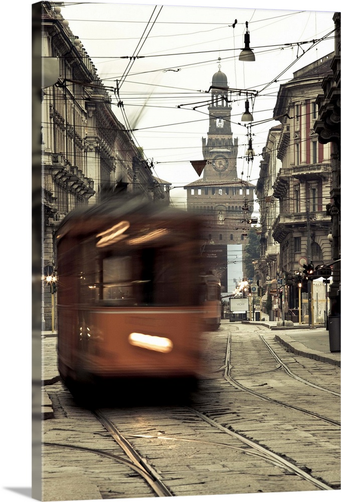 ITALY, Milan Province, Milan. Milan trams on Via Orefici with Castello Sforzesco, dawn.