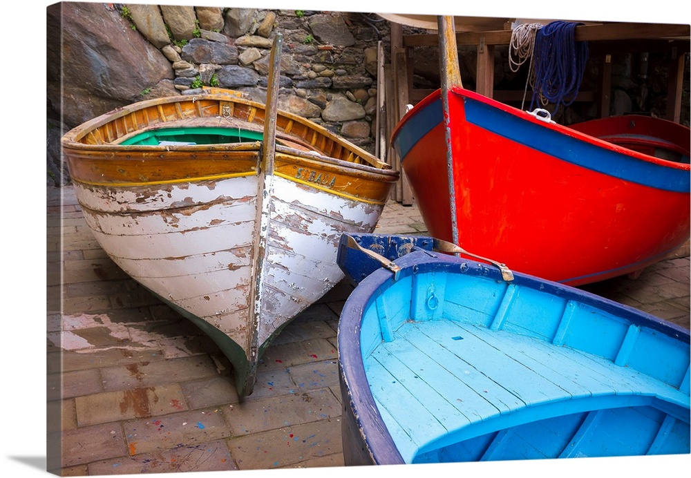 Italy, Riomaggiore. Colorful fishing boats. Credit: Jim Nilsen