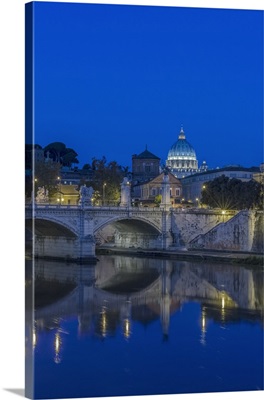 Italy, Rome, Tiber River and Ponte Vittorio Emanuele with St. Peter's Basilica at dawn