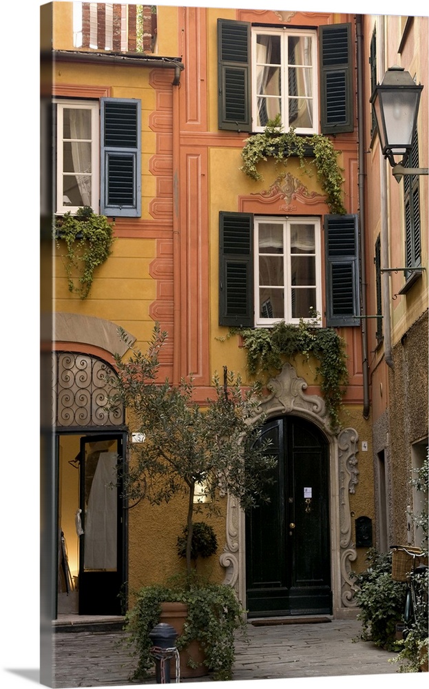 Europe, Italy, Santa Margherita Ligure. Inviting courtyard of a decorated building.