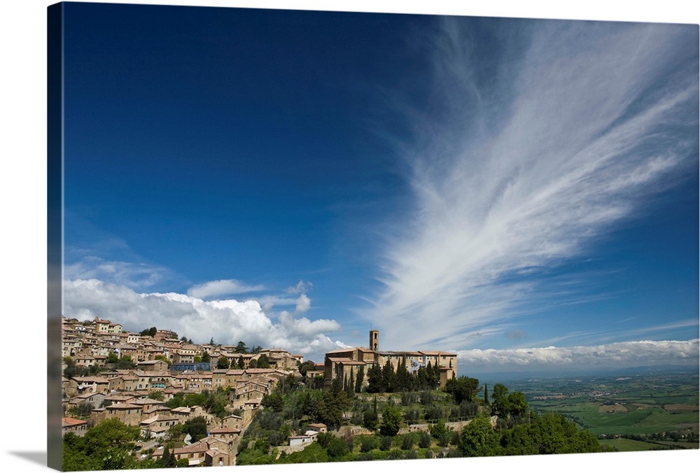 Italy, Tuscany. Dramatic clouds over the hill town of Montalcino.