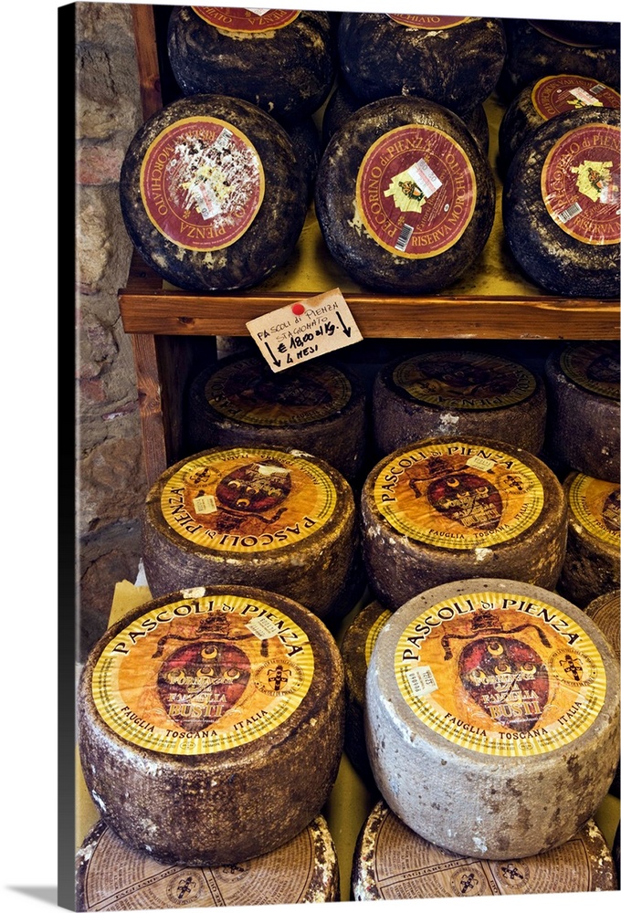 Europe, Italy, Tuscany, Pienza. An assortment of Italian cheese in a shop.