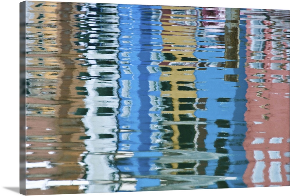 Italy, Venice, Burano. Multicolored houses reflected in water.