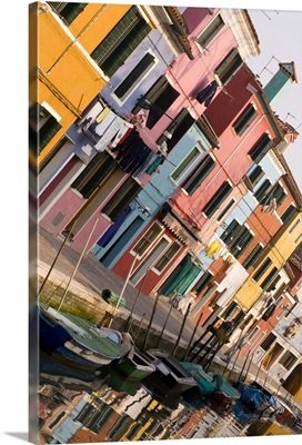 Italy, Venice, Burano. Tilted view of colorful houses and their reflections on a canal