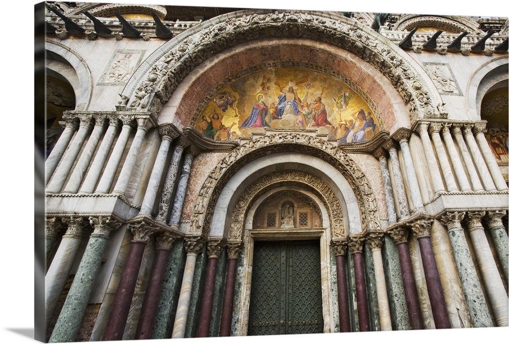 Europe, Italy, Venice. detail of the carvings and facade Mosaics on the Basilica San Marco-Venice.