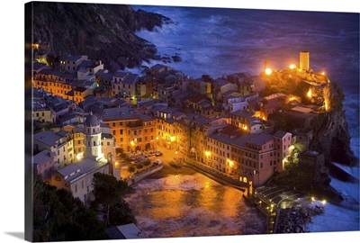 Italy, Vernazza, Cinque Terra. Overview of city lit at night