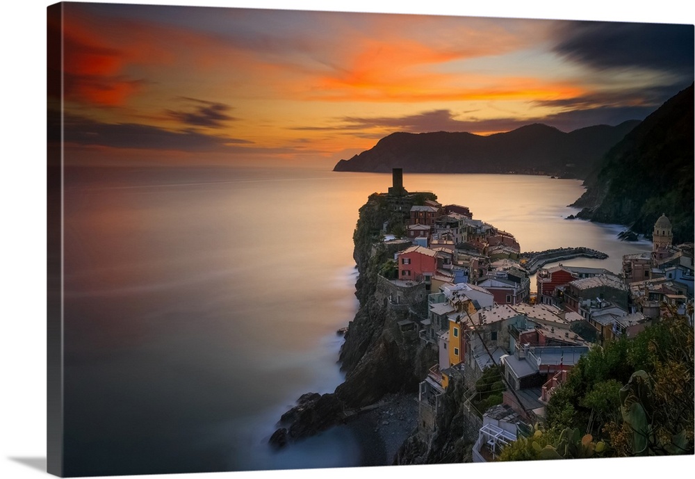 Italy, Vernazza. Overview of coastal town at sunset. Credit: Jim Nilsen