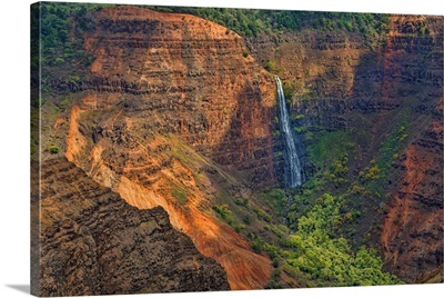 Kauai Hawaii, Waimea Canyon State Park, Red cliffs from above canyon, distant waterfall