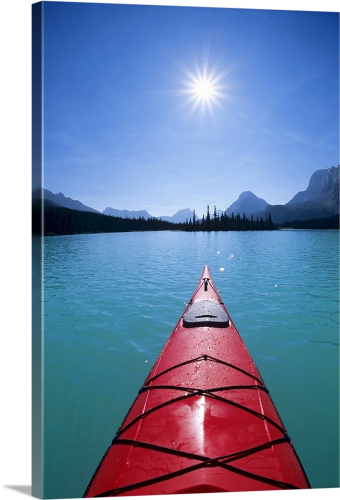 Kayaking on Bow Lake in the Canadian Rockies of Banff National Park, Alberta, Canada.
