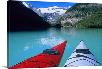 Kayaks on Lake Louise below Mount Victoria, Banff National Park, Alberta