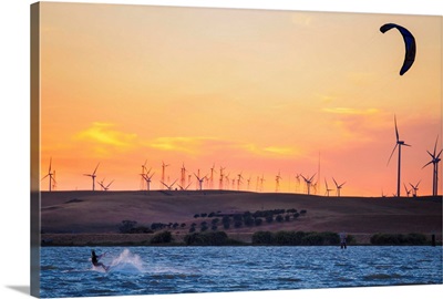 Kiteboarder At Sunset With Wind Farm Turbines In Background, Rio Vista, California