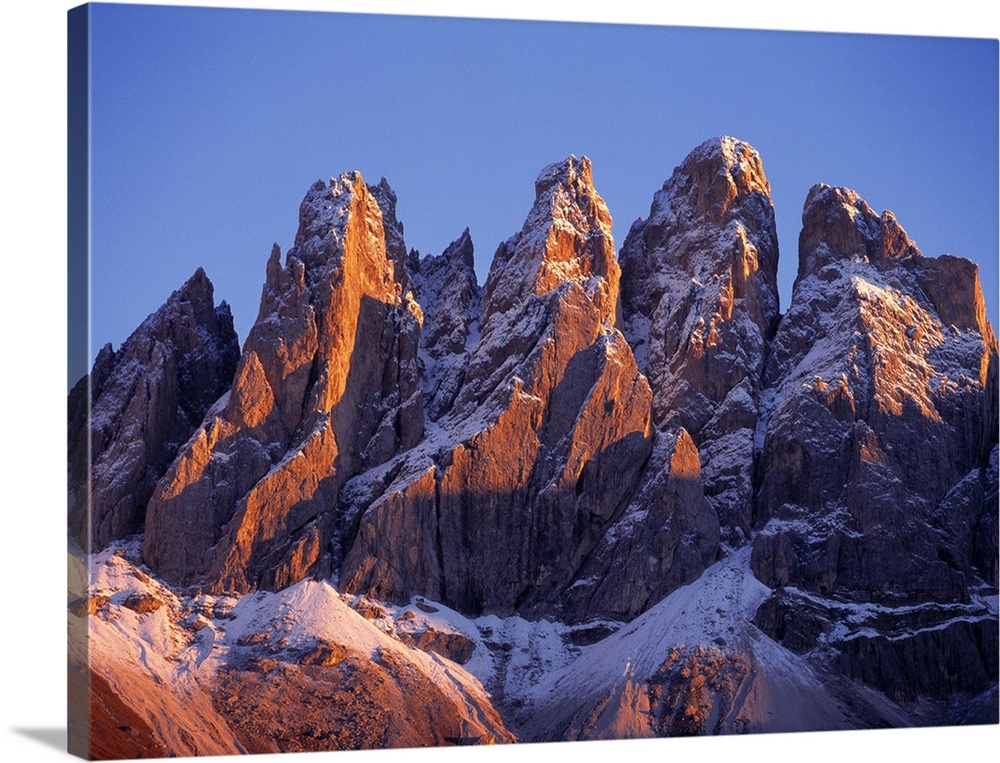 Europe, Italy, Odle Group. Late light rests on the craggy, snow-dusted peaks of the Odle Group, in the Dolomite Alps, Italy.