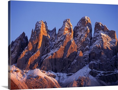 Late light rests on the peaks of the Odle Group, in the Dolomite Alps, Italy.