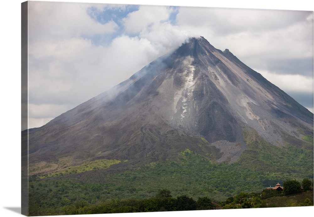 Lava rocks are thrown from the erupting Arenal volcano to the mountainside and forest below in Arenal, Costa Rica.