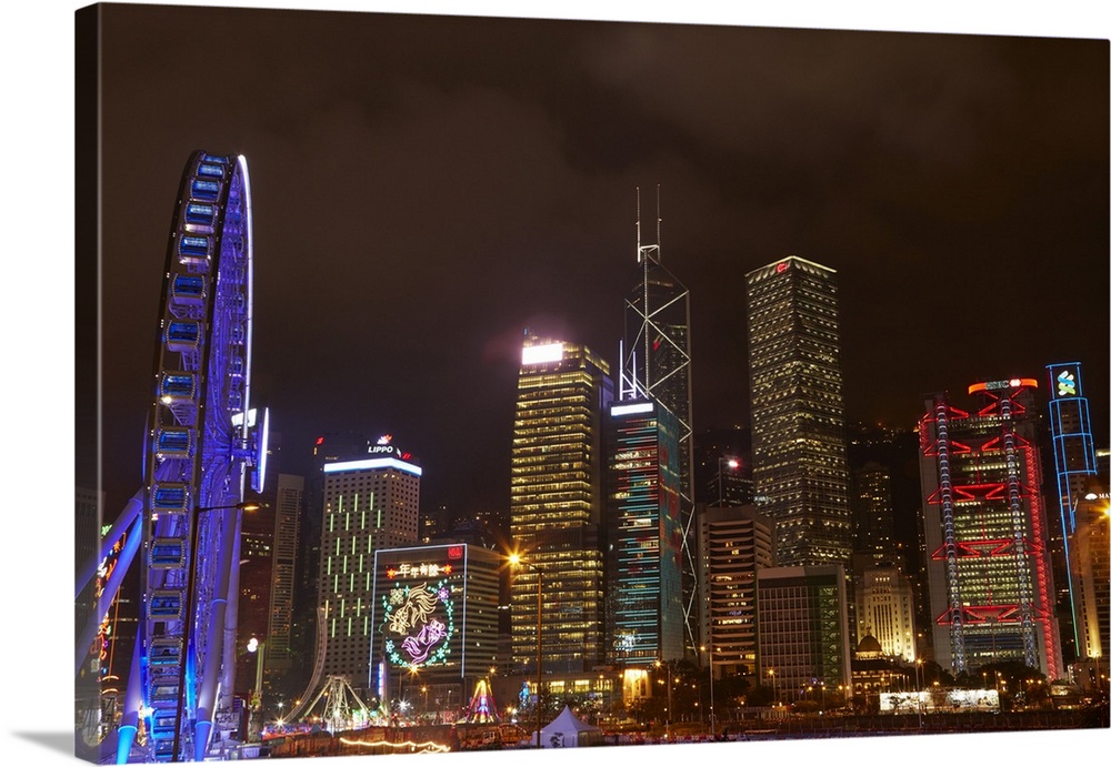 Light show on skyscrapers, and Hong Kong Observation Wheel, Central, Hong Kong Island, Hong Kong, China