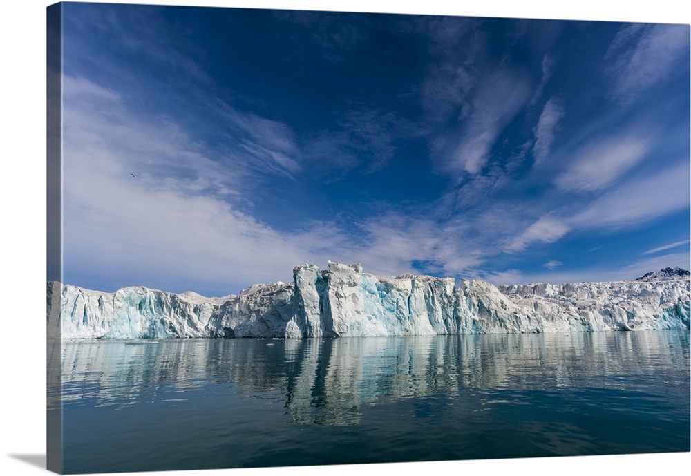 Lilliehook Glacier and its mirror reflection on arctic waters. Lilliehookfjorden, Spitsbergen Island, Svalbard, Norway.