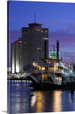 Louisiana, New Orleans. World Trade Center, riverboat and Mississippi Riverfront, dusk