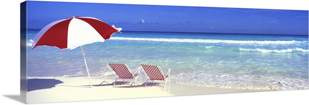 Panoramic of Lounge Chairs and Umbrella on the Beach in Paradise Island, Bahamas.