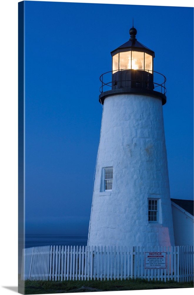 Maine, Pemaquid. Light from the historical lighthouse offers protection to ships at sea along the coast.