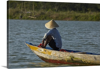 Man Fishing From Boat On Thu Bon River, Hoi An (UNESCO World Heritage Site), Vietnam