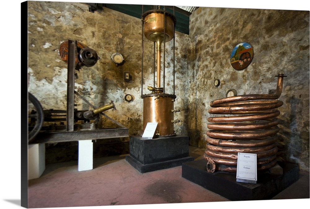 MARTINIQUE. French Antilles. West Indies. St. Pierre. Old copper distillation equipment in museum on grounds of Depaz rum ...