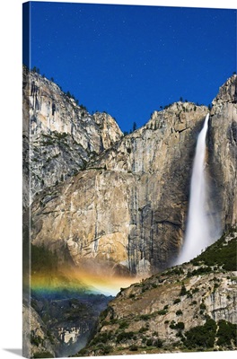 Moonbow and starry sky over Yosemite Falls, California