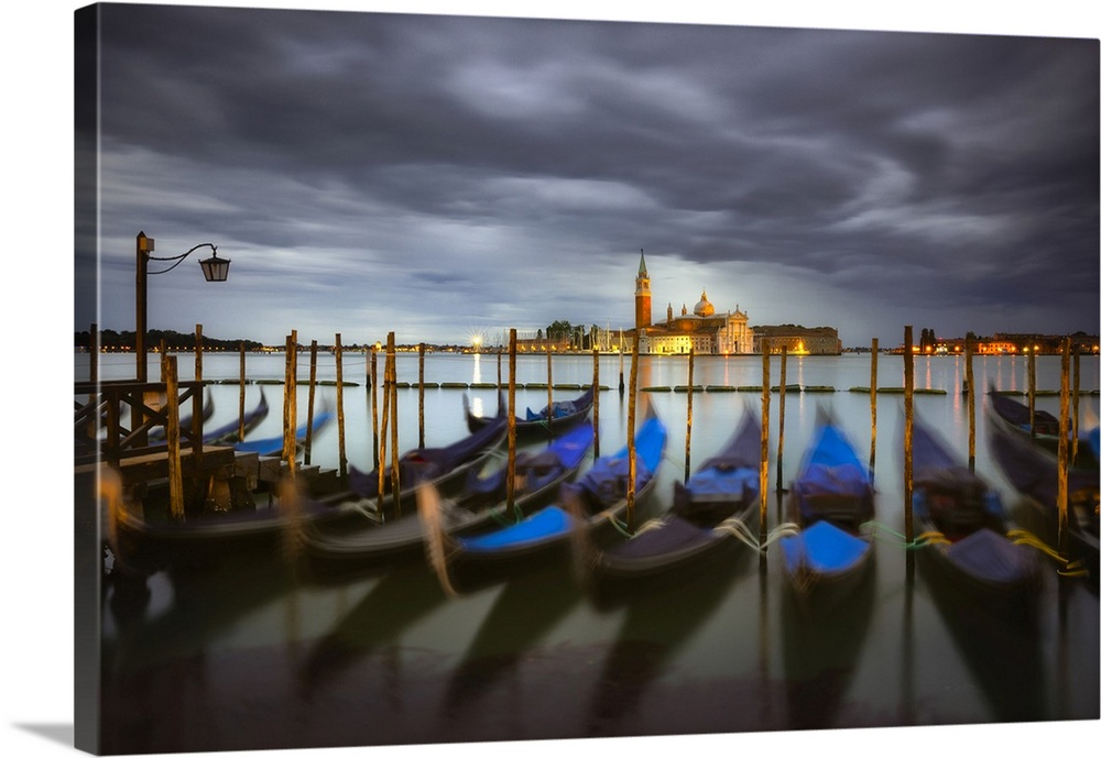 Italy, Venice. Moored gondolas and Church of San Giorgio Maggiore at sunrise. Credit: Jim Nilsen
